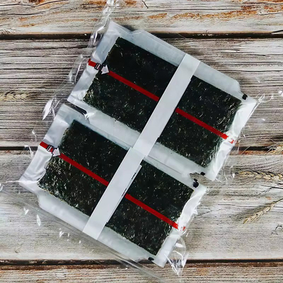 Triangolo Onigiri Nori con alghe al vapore Triangolo Laver Alga in imballaggio di plastica