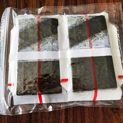 Triangolo Onigiri Nori con alghe al vapore Triangolo Laver Alga in imballaggio di plastica